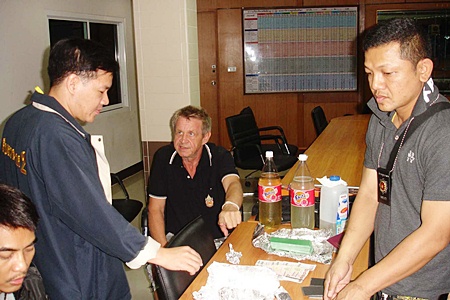 German Peter-Jurgen Gramm (seated, back center) has been remanded to custody for allegedly trying to work the Nigerian “black money” currency-counterfeiting scam.